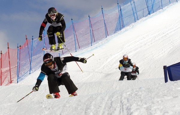  Junior World Champion, Fanny Smith (SUI) flys high over competition Katrin Ofner (AUT)